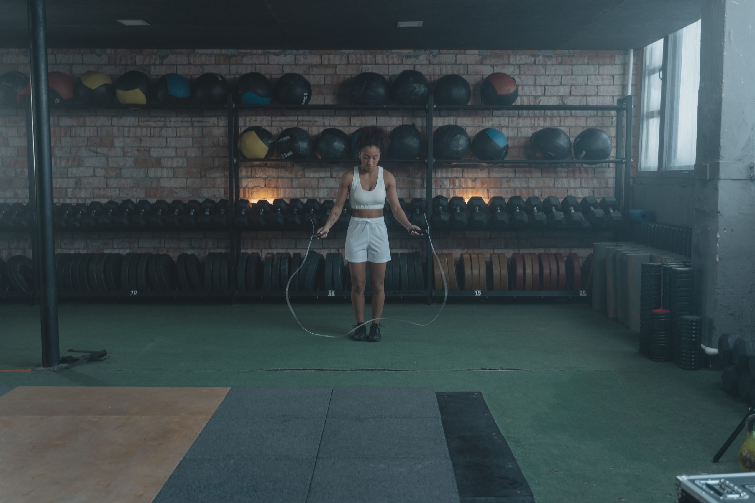woman jumping rope in gym